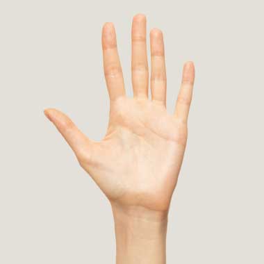 A close-up of an adult hand showing number 5.